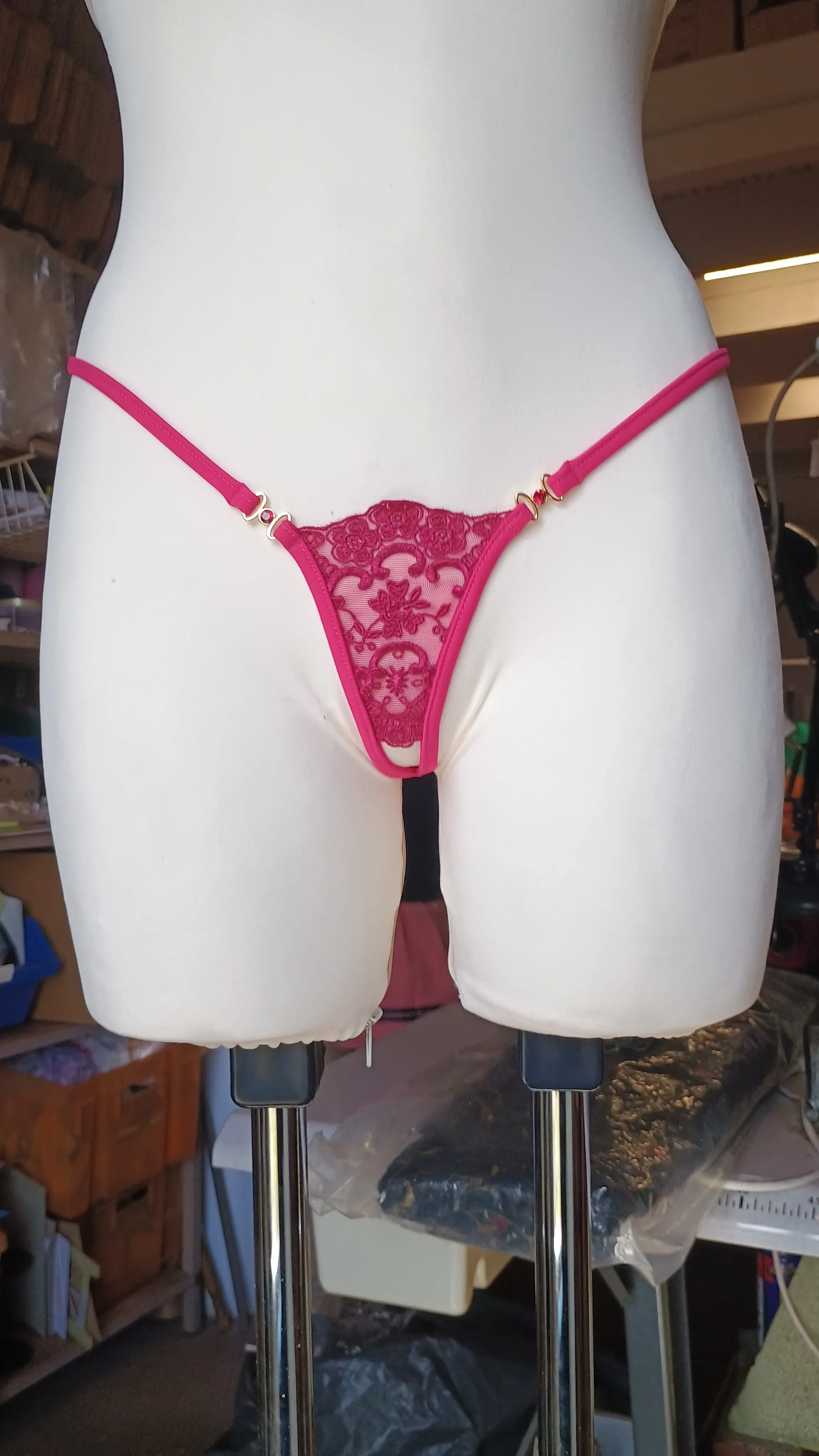 Pink lace thong product photo on mannequin used as the source image for Qwen Intimate generation