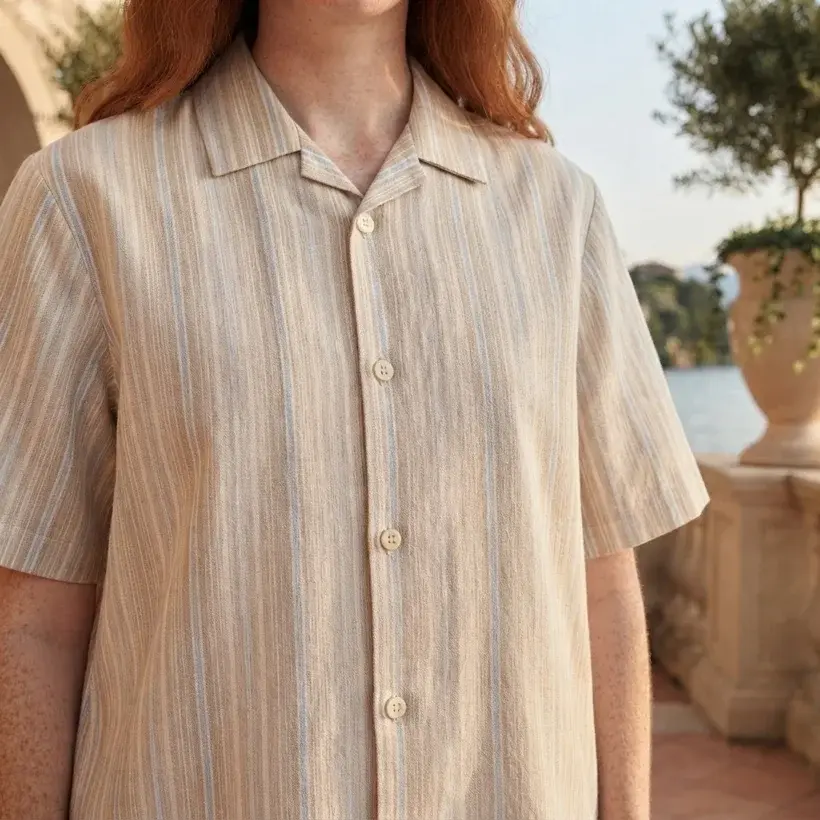 Front clothing detail image of a beige striped resort shirt generated in Uwear with Gemini Flash-Lite 3.1