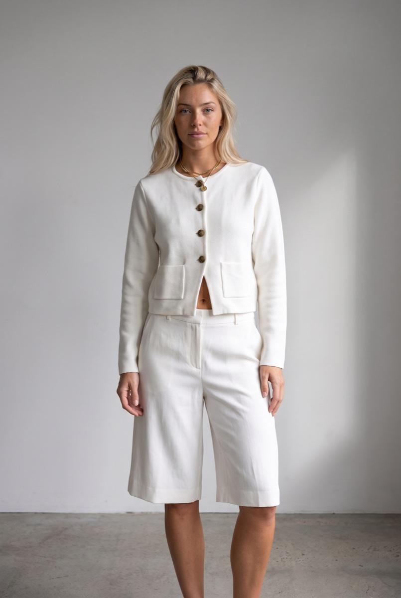 Approved retry of the same look: the saved model in the four-button white jacket with white culottes