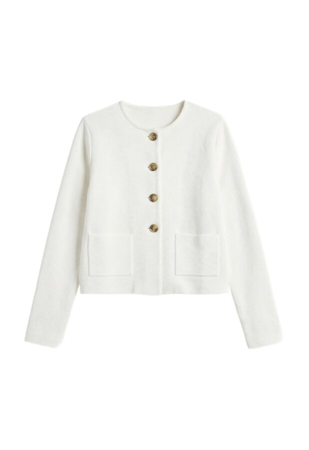 Saved garment, a cropped ivory jacket, kept as a reusable clothing reference