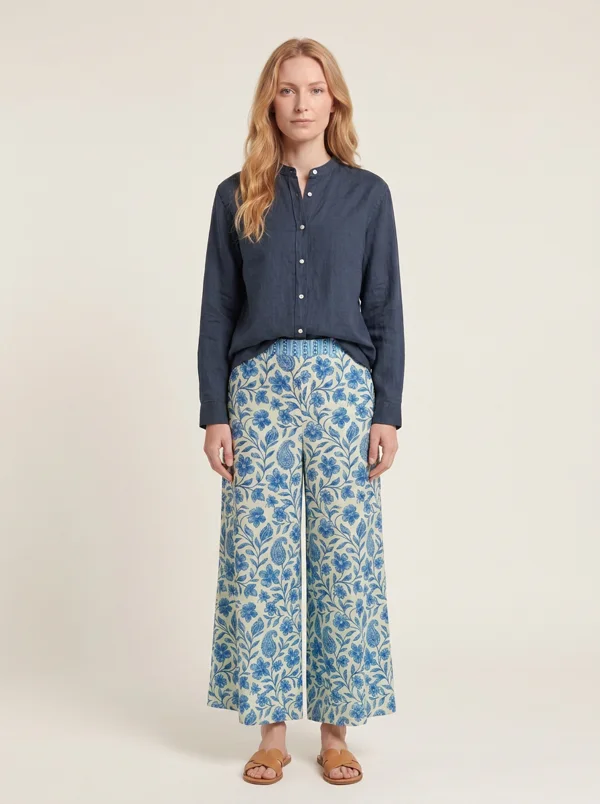 The linen shirt and floral trousers outfit on the first model, generated with Gemini Flash 2