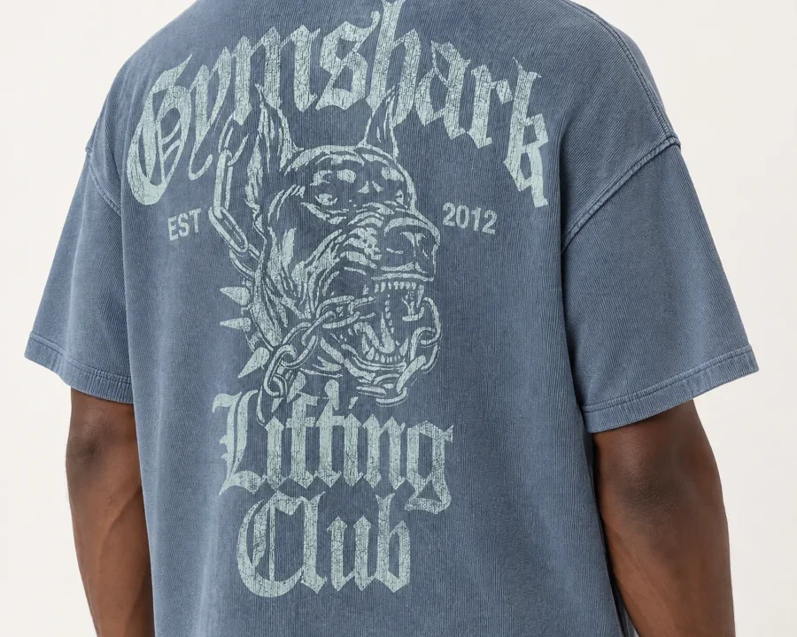 Close crop on the back of a Gymshark T-shirt worn by a model, the full back graphic carried from the product photo, generated with GPT Image 2.5 High inside Uwear