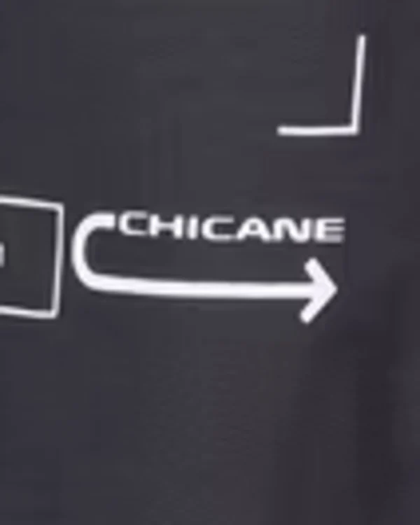 Detail of the product photo of a dark sweatshirt: a small white label that reads CHICANE above an arrow