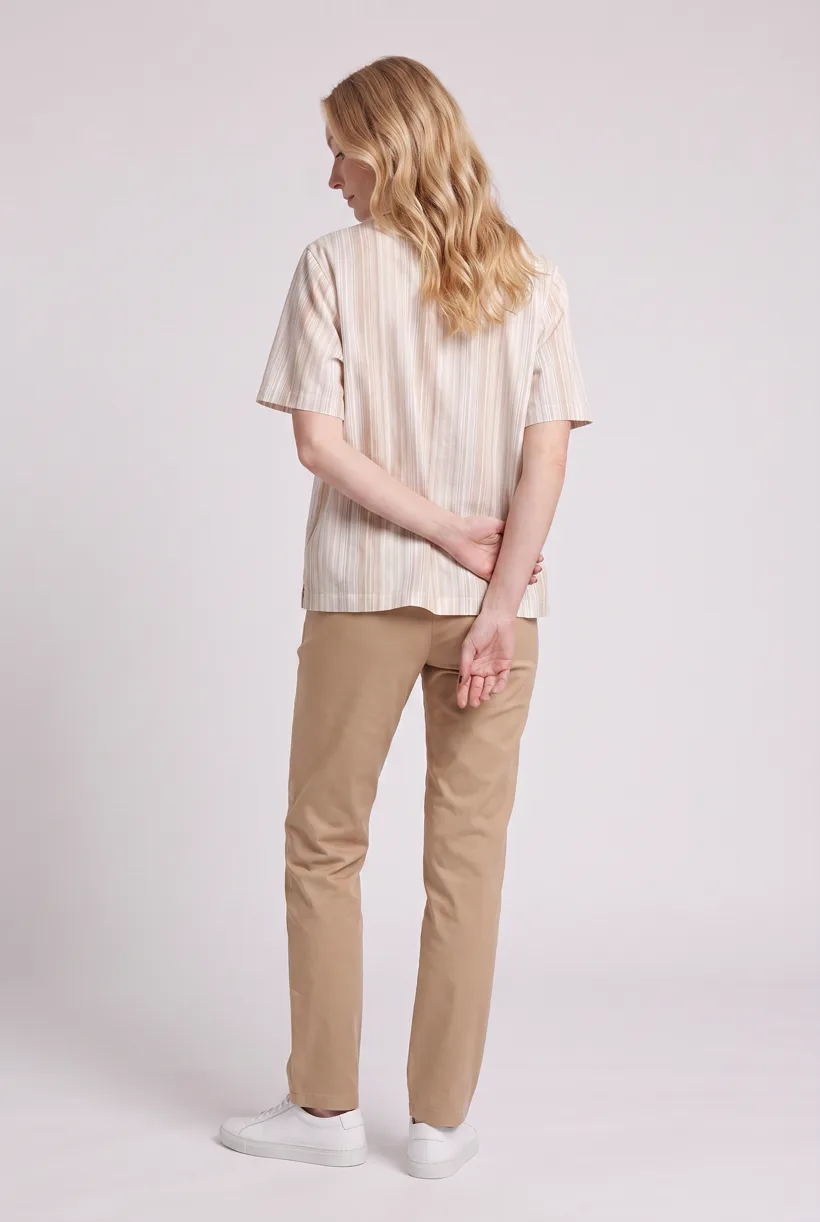 Model wearing the same striped camp-collar resort shirt, full-body back camera edit on the Pure White studio, generated with nano-banana-pro through the Product page set template