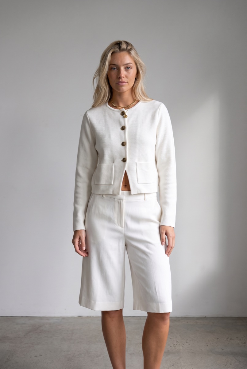 Approved retry of the same look with the correct four-button jacket