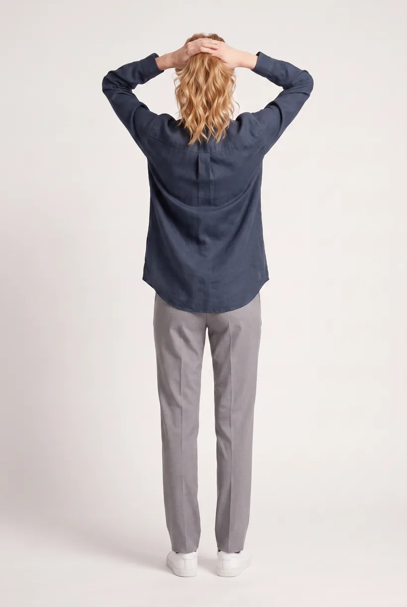 Model wearing the same navy band-collar work shirt, full-body back camera edit on the Pure White studio, generated with nano-banana-pro through the Product page set template
