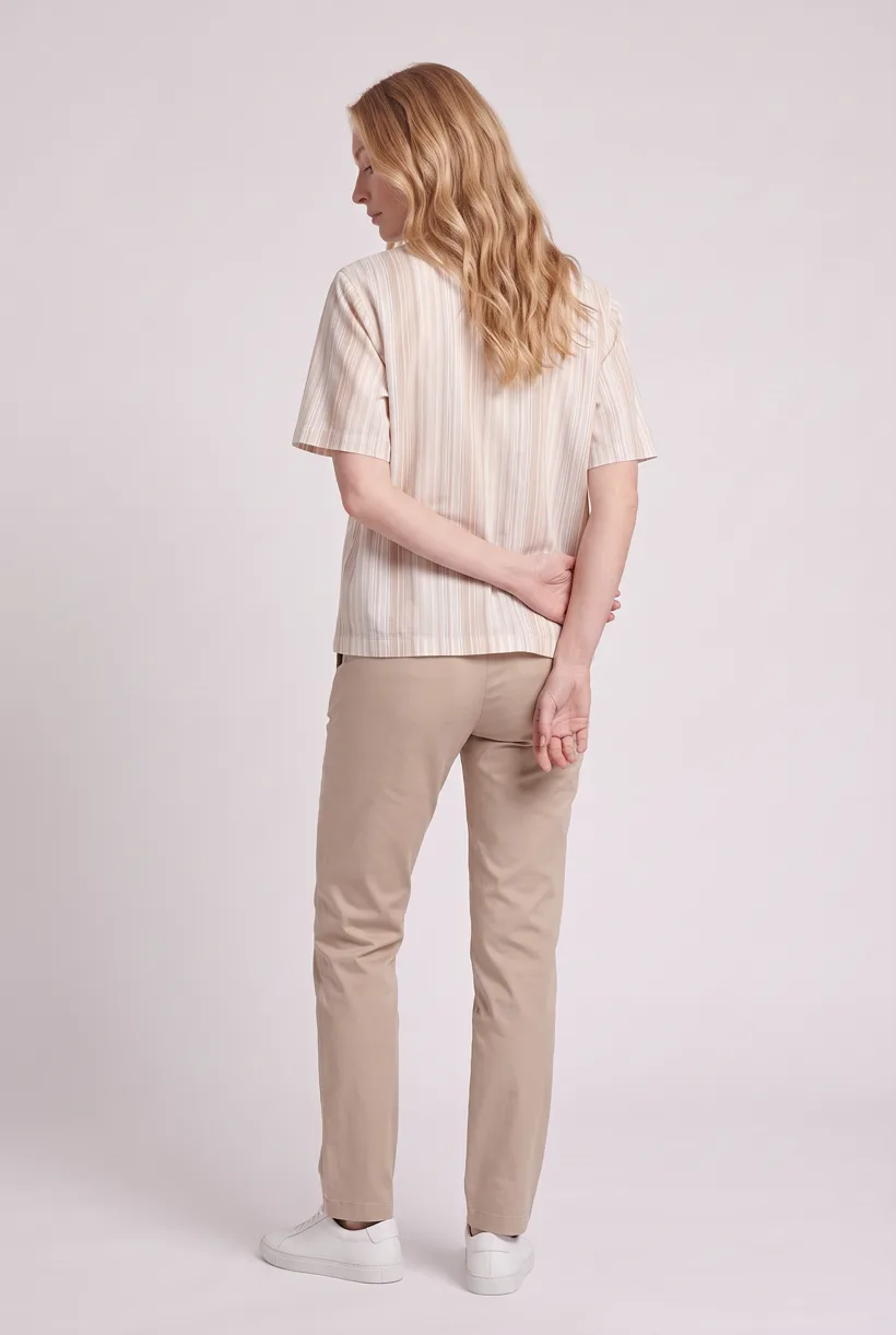 Model wearing the same striped camp-collar resort shirt, full-body back camera edit on the Pure White studio, generated with nano-banana-pro through the Product page set template