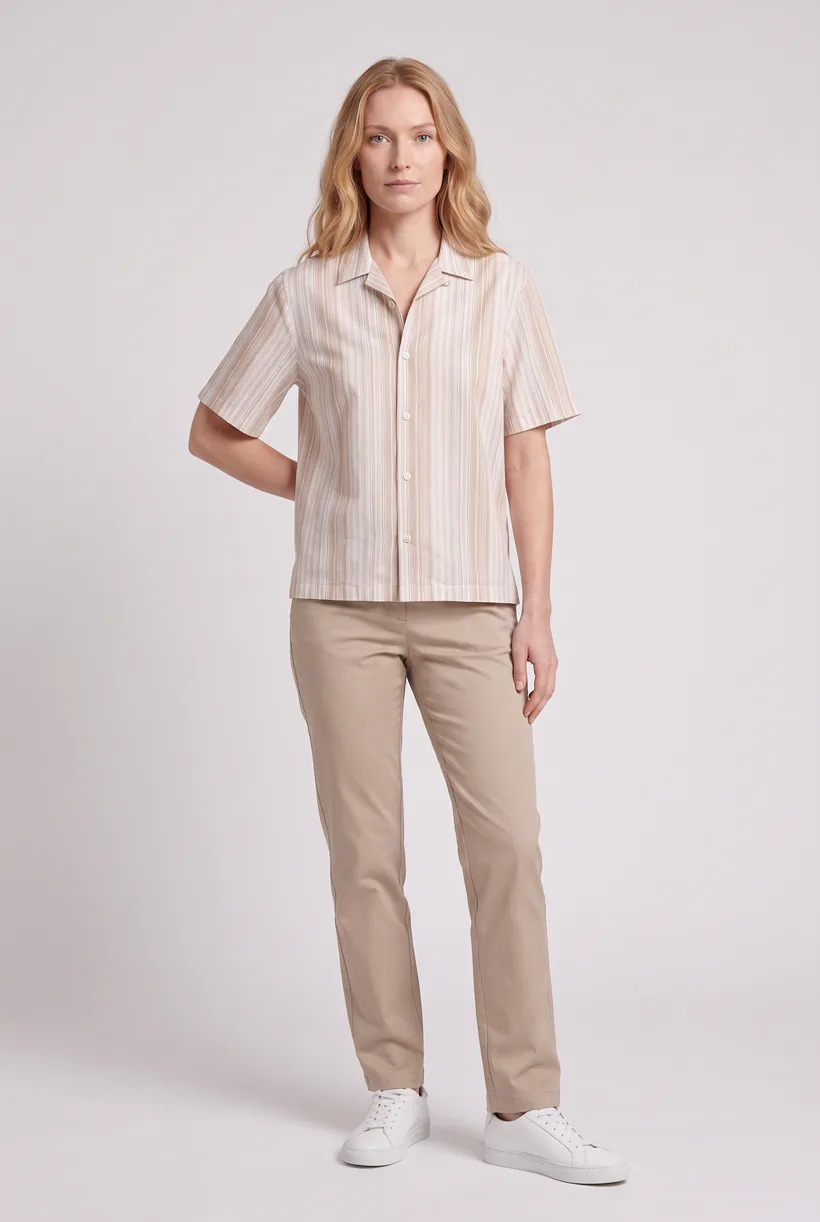 Model wearing a striped camp-collar resort shirt, full-body front on the Pure White studio, generated with nano-banana-pro through the Product page set template