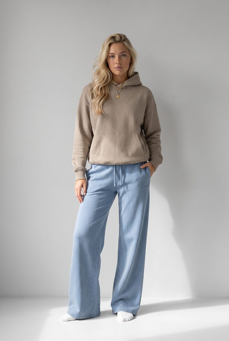 Taupe hoodie paired with sweatpants, on model