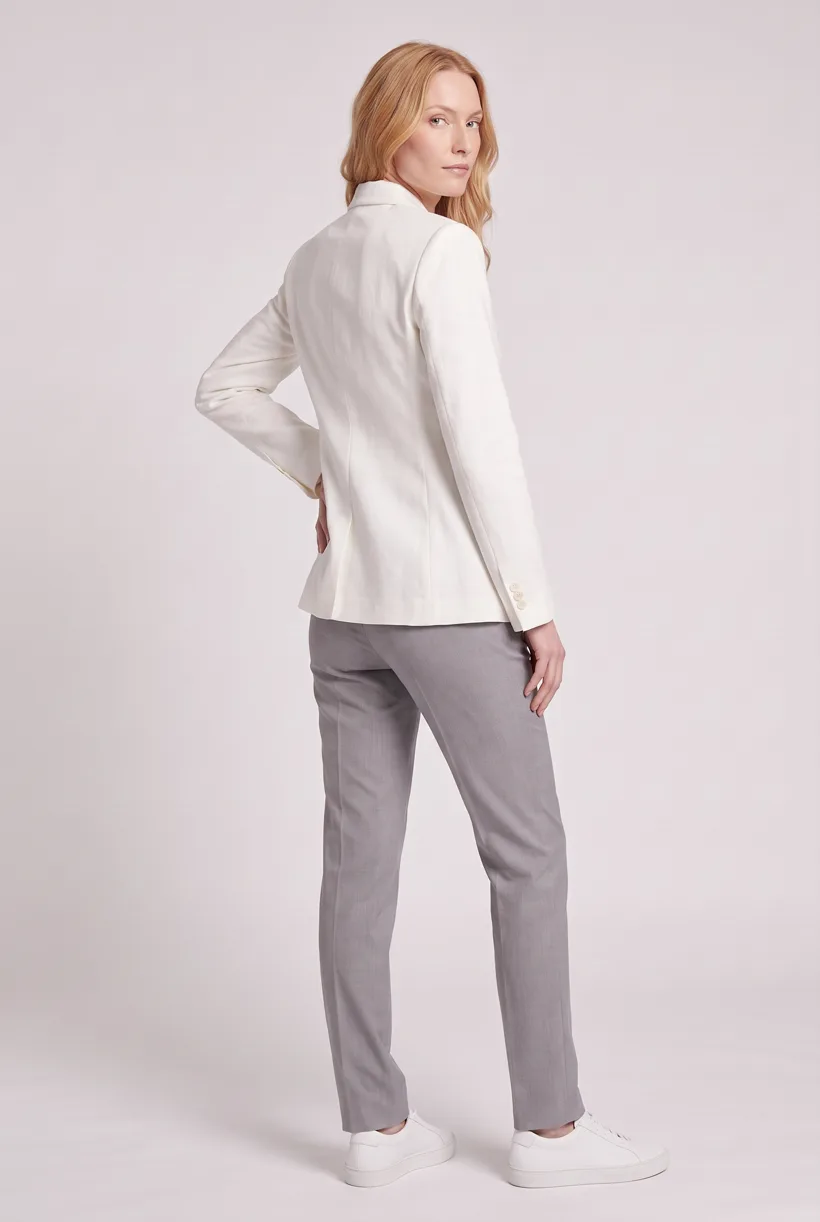 Model wearing the same linen blazer, full-body back camera edit on the Pure White studio, generated with nano-banana-pro through the Product page set template